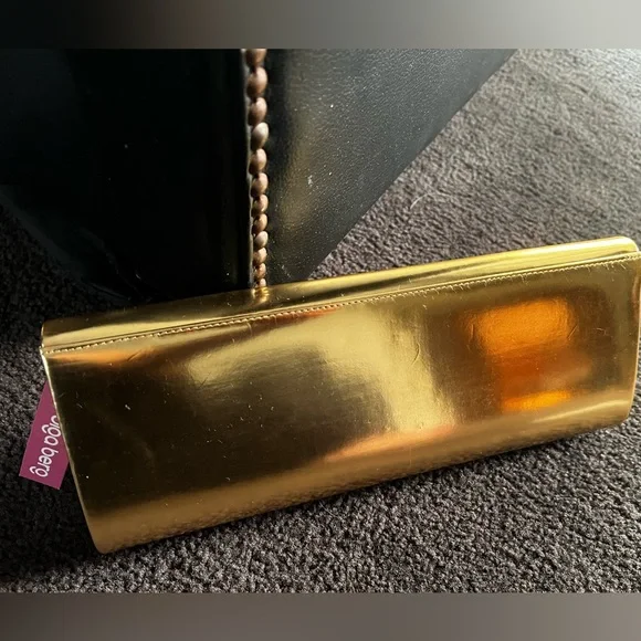 NWT - Olga berg gold clutch bag. NWT. Comes with chain strap. Rectangular clasp. - Picture 4 of 15